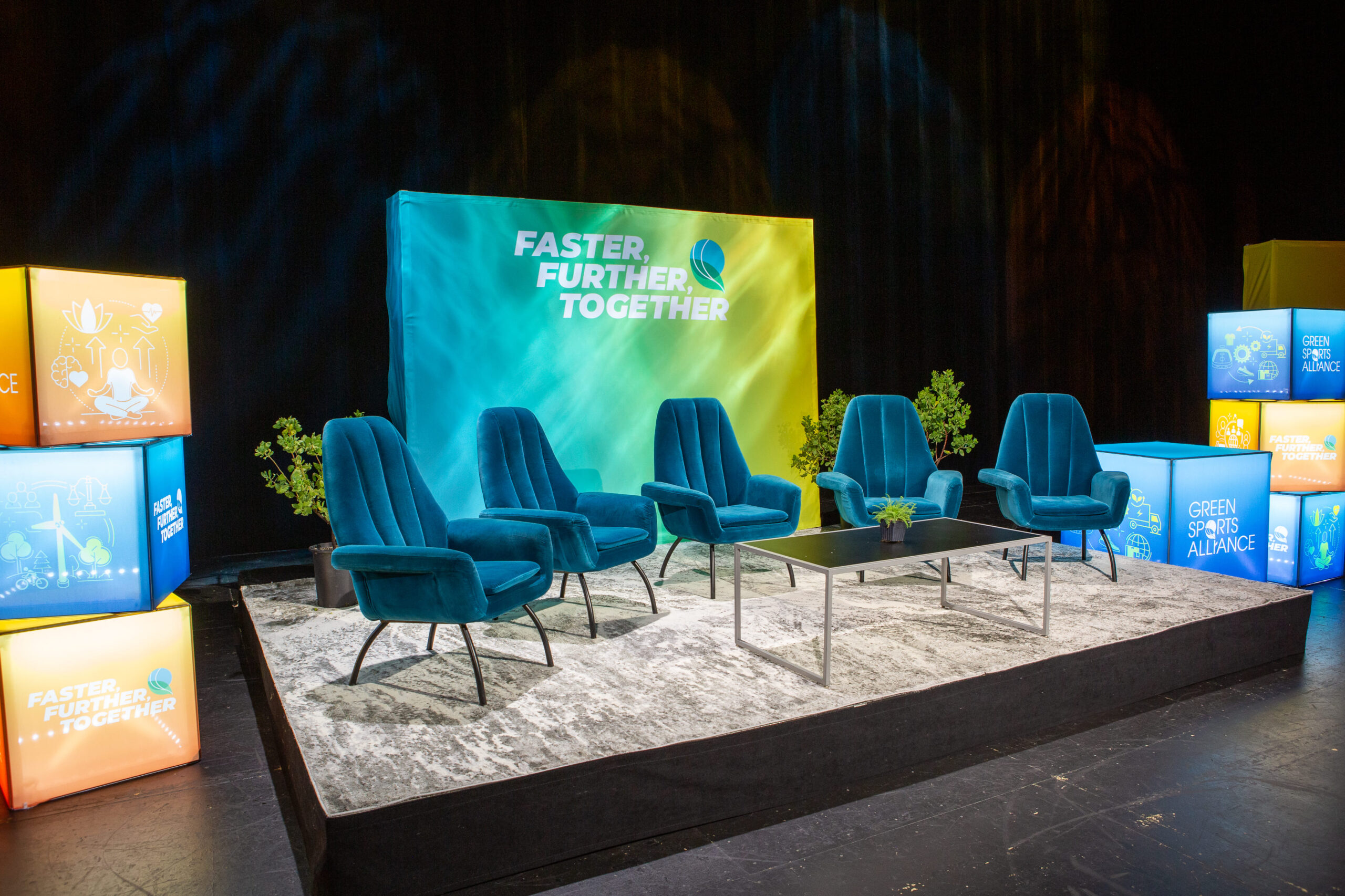 Green Sports Alliance Summit stage showcasing sustainable event design and branded graphics before a panel session.