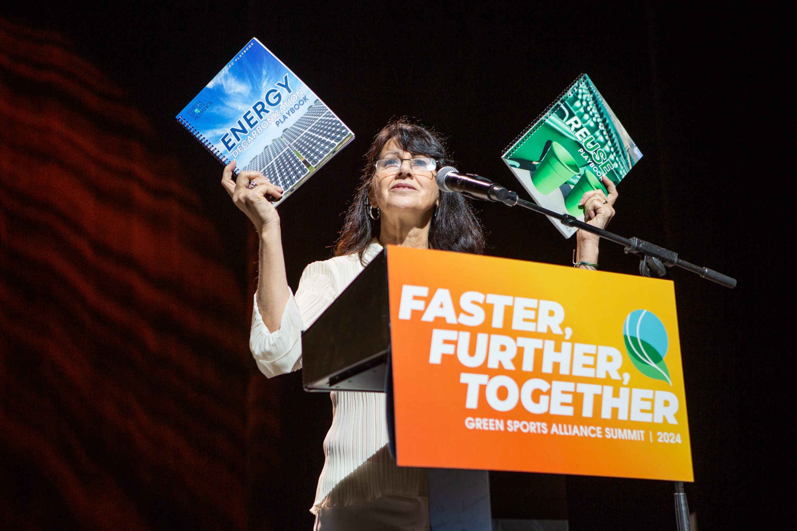 Speaker presenting sustainability playbooks during the Green Sports Alliance Summit 2024.