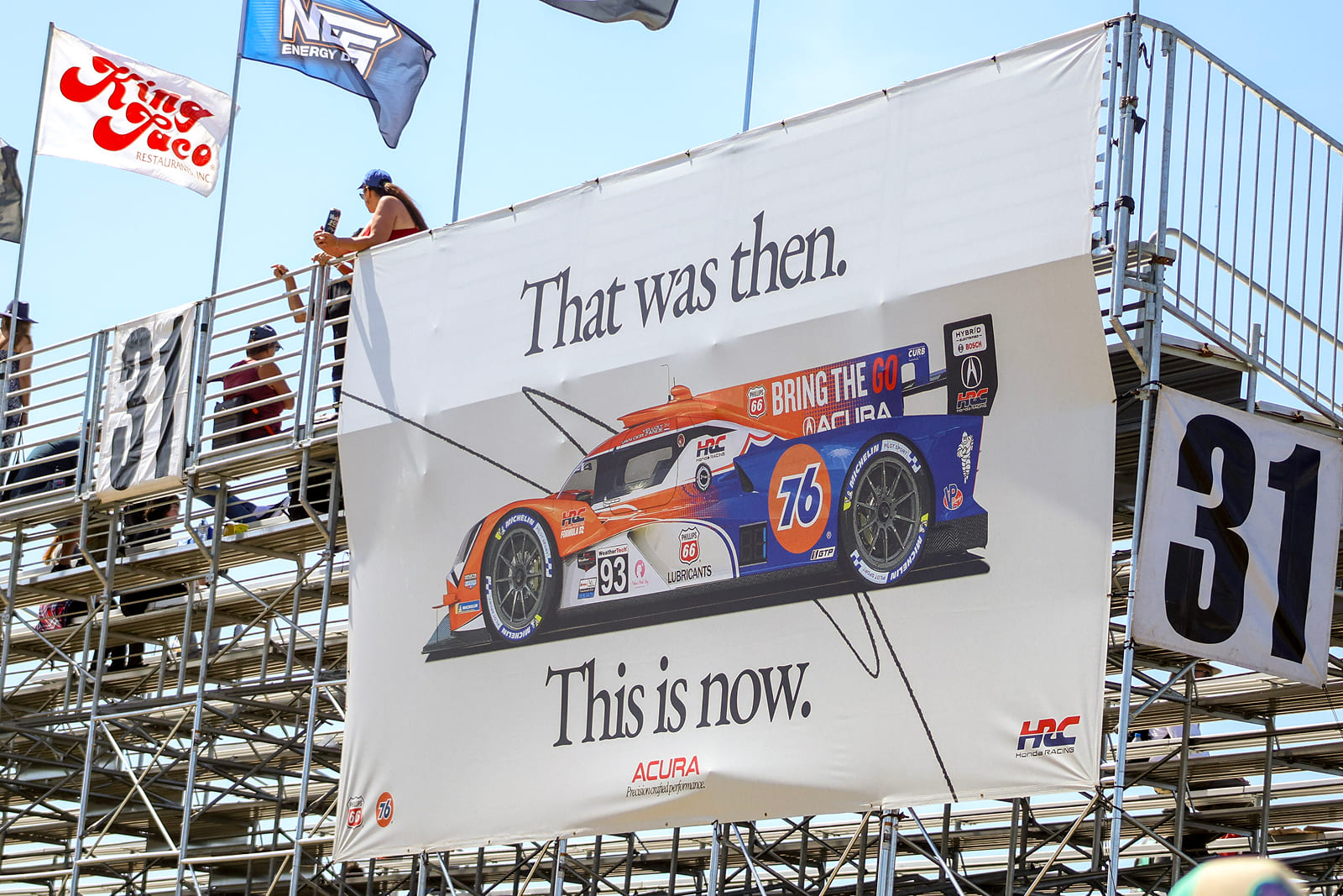 Large-format grandstand billboard produced by A3 Visual overlooking the Acura Grand Prix of Long Beach.