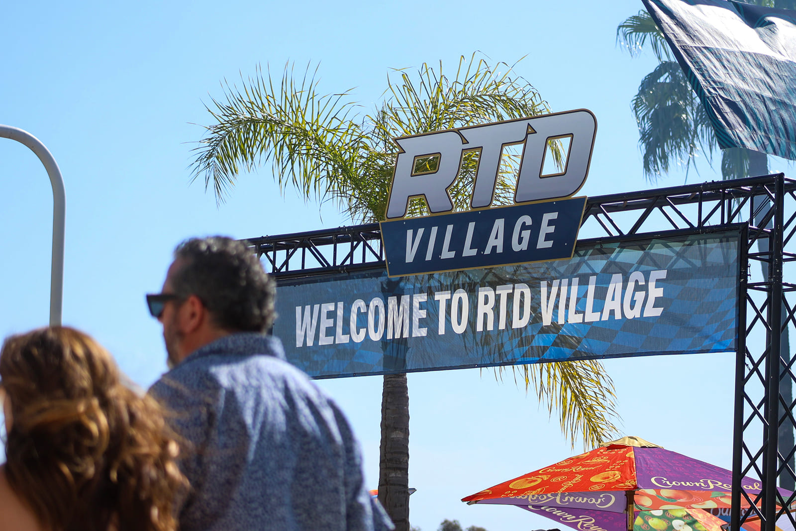 Custom welcome signage installed at the RTD Village entrance for the Acura Grand Prix of Long Beach.