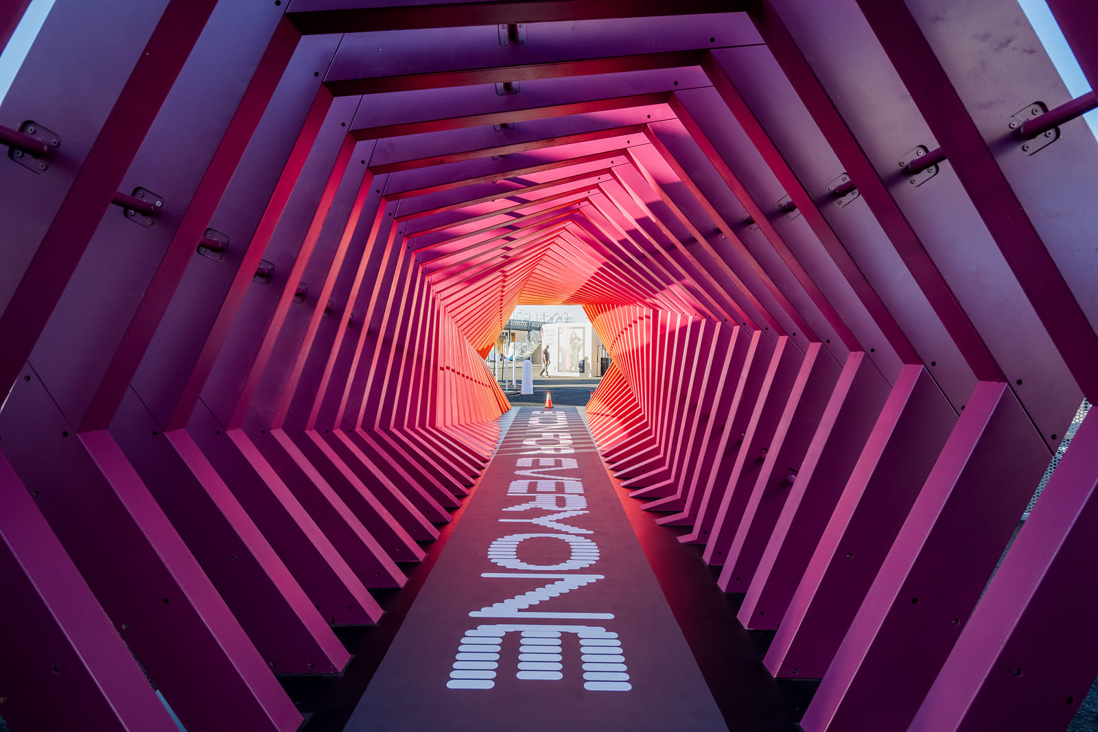 Immersive branded tunnel featuring custom graphics created for Block By Block 2025 at the Oakland Coliseum.