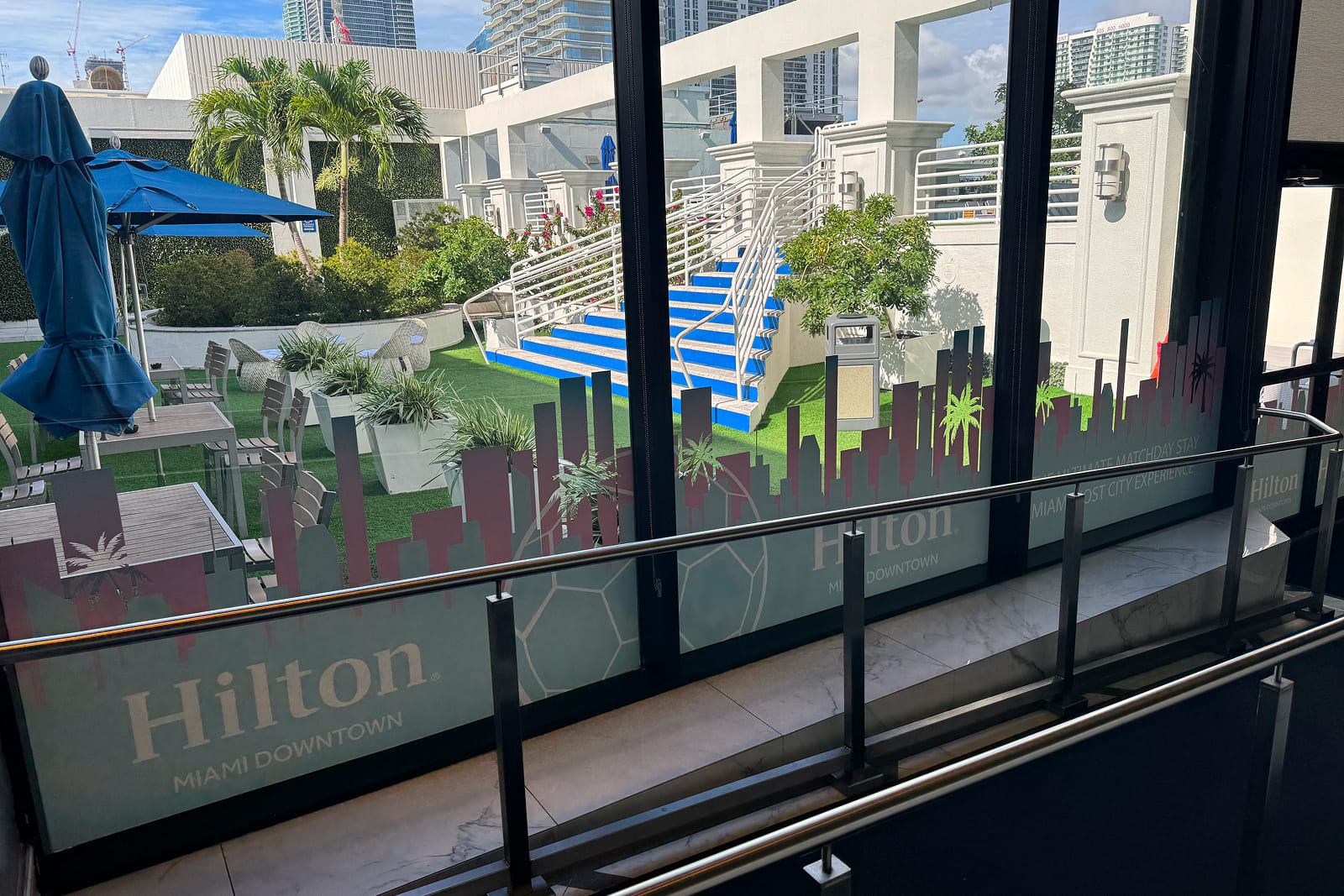Exterior view of Hilton Miami Downtown featuring custom large-format window graphics designed and installed by A3 Visual.