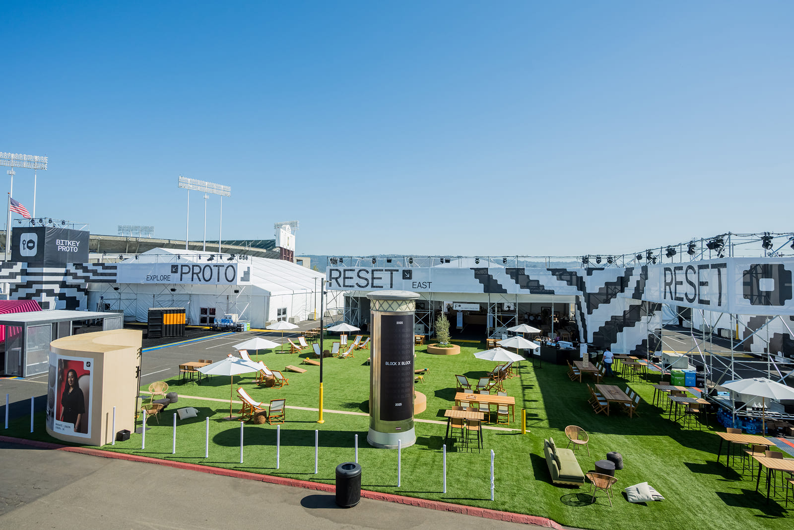 Outdoor activation space featuring custom large-format graphics and environmental branding for Block By Block 2025.