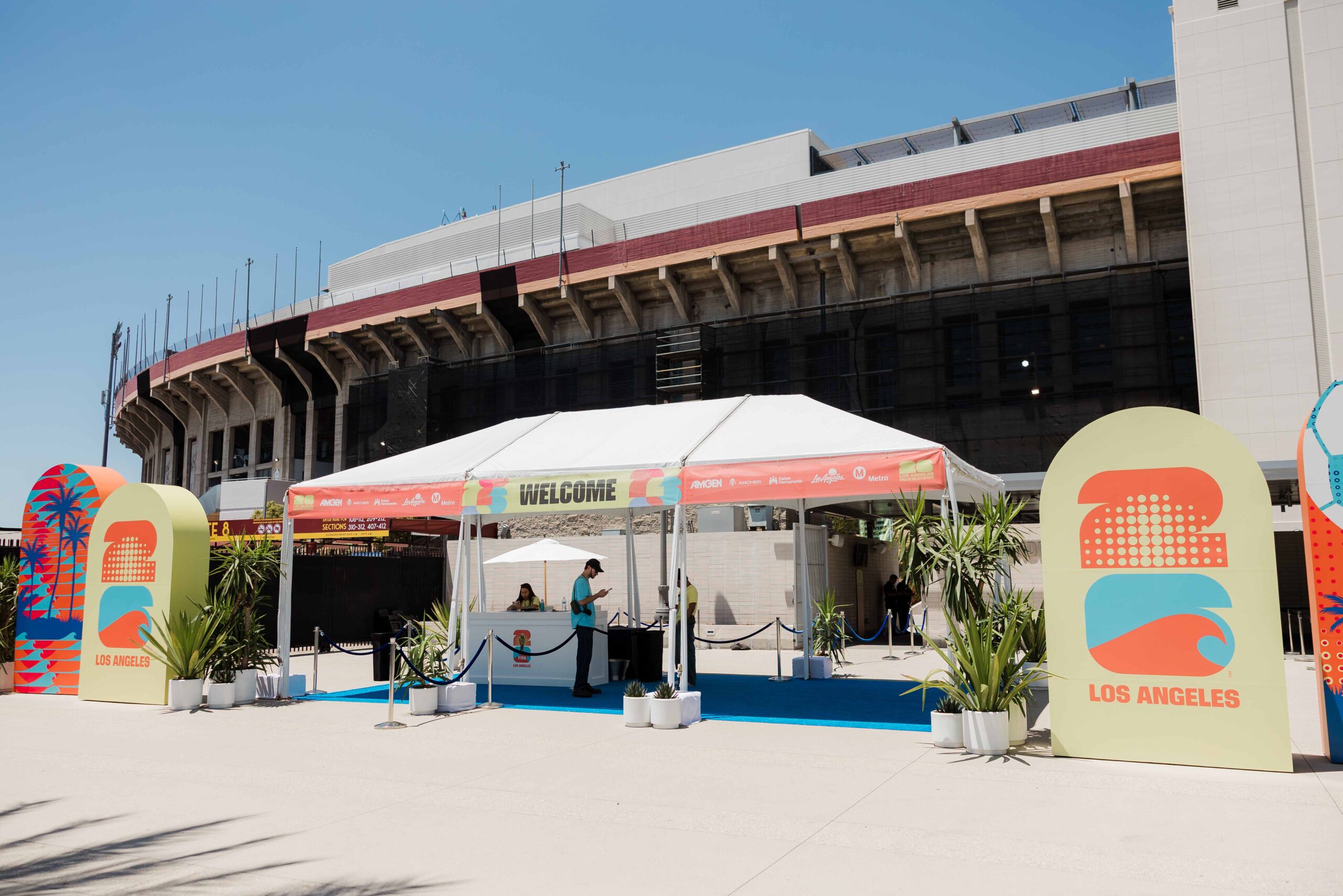 Main entrance to FIFA Fan Fest featuring large-format event branding, wayfinding graphics, and custom environmental signage produced by A3 Visual.