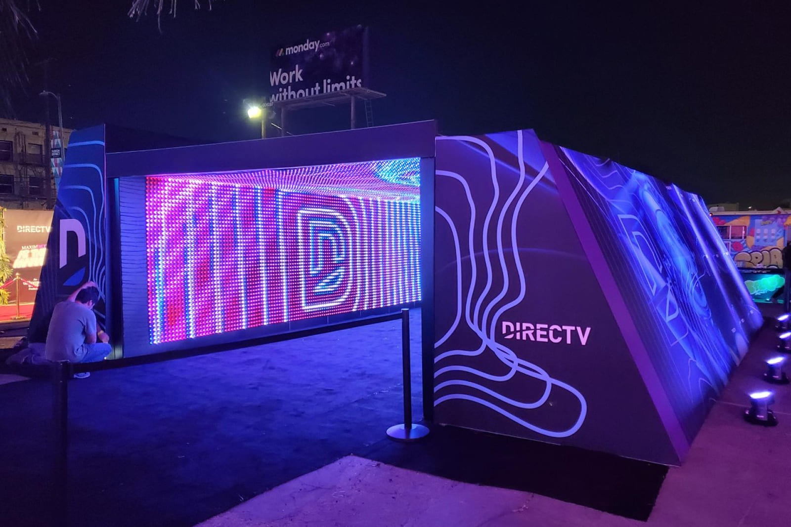 Angled view of the DIRECTV LED tunnel activation showcasing custom graphics and immersive entrance design.