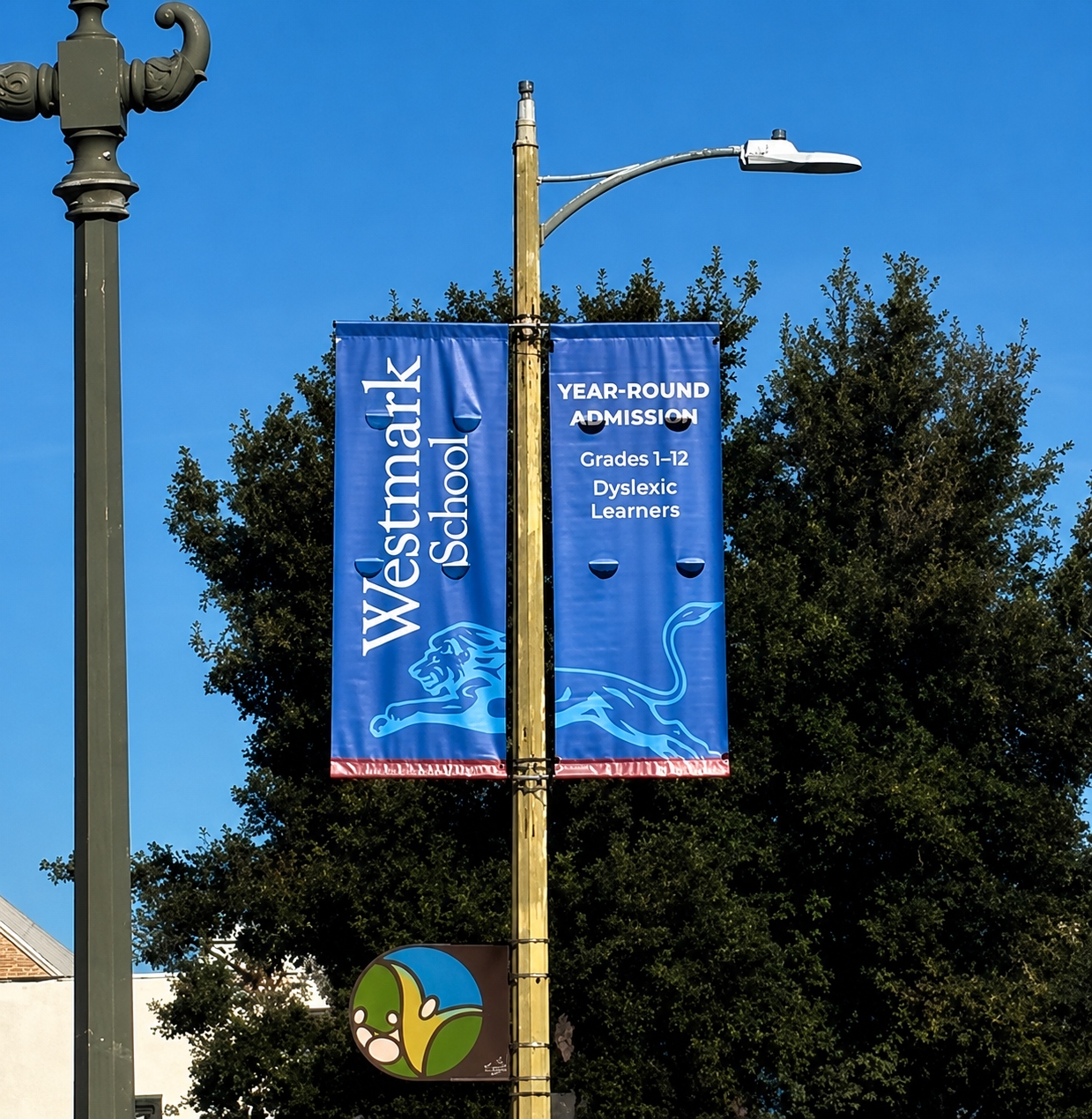 A3 Visual-produced street pole banners promoting Westmark School, supporting students with language-based learning differences through community signage.