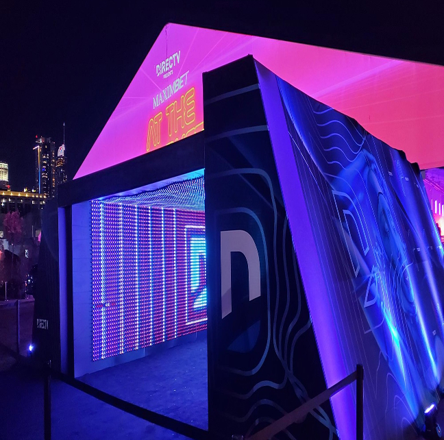 DIRECTV branded LED tunnel activation featuring custom large-format graphics and immersive lighting installed by A3 Visual for Super Bowl LVI in Los Angeles.