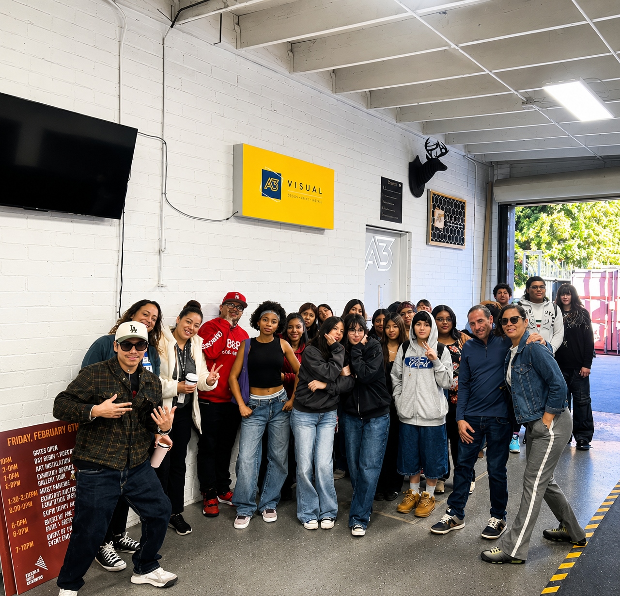 Students visiting A3 Visual's production facility during an educational tour, learning about careers in large-format printing, fabrication, and visual communications.
