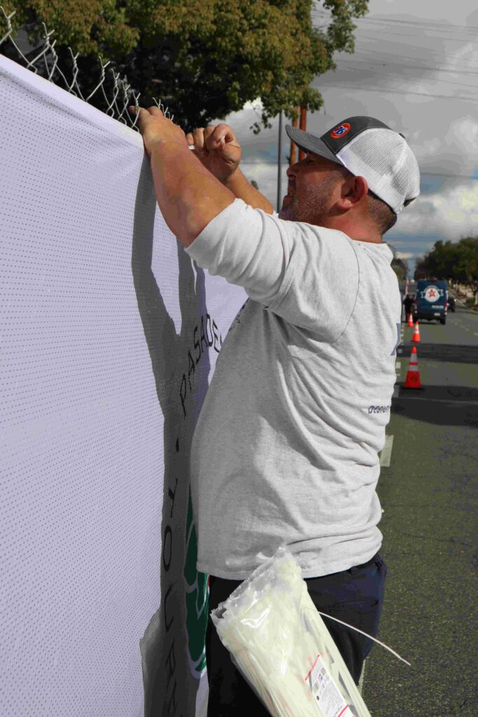 Large-format fence banners installed by A3 Visual along the Tournament of Roses Rose Parade route.
