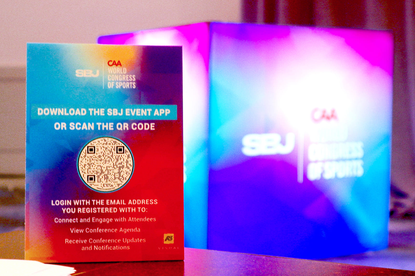 Custom branded event signage and conference graphics welcoming attendees at the Sports Business Journal World Congress of Sports.