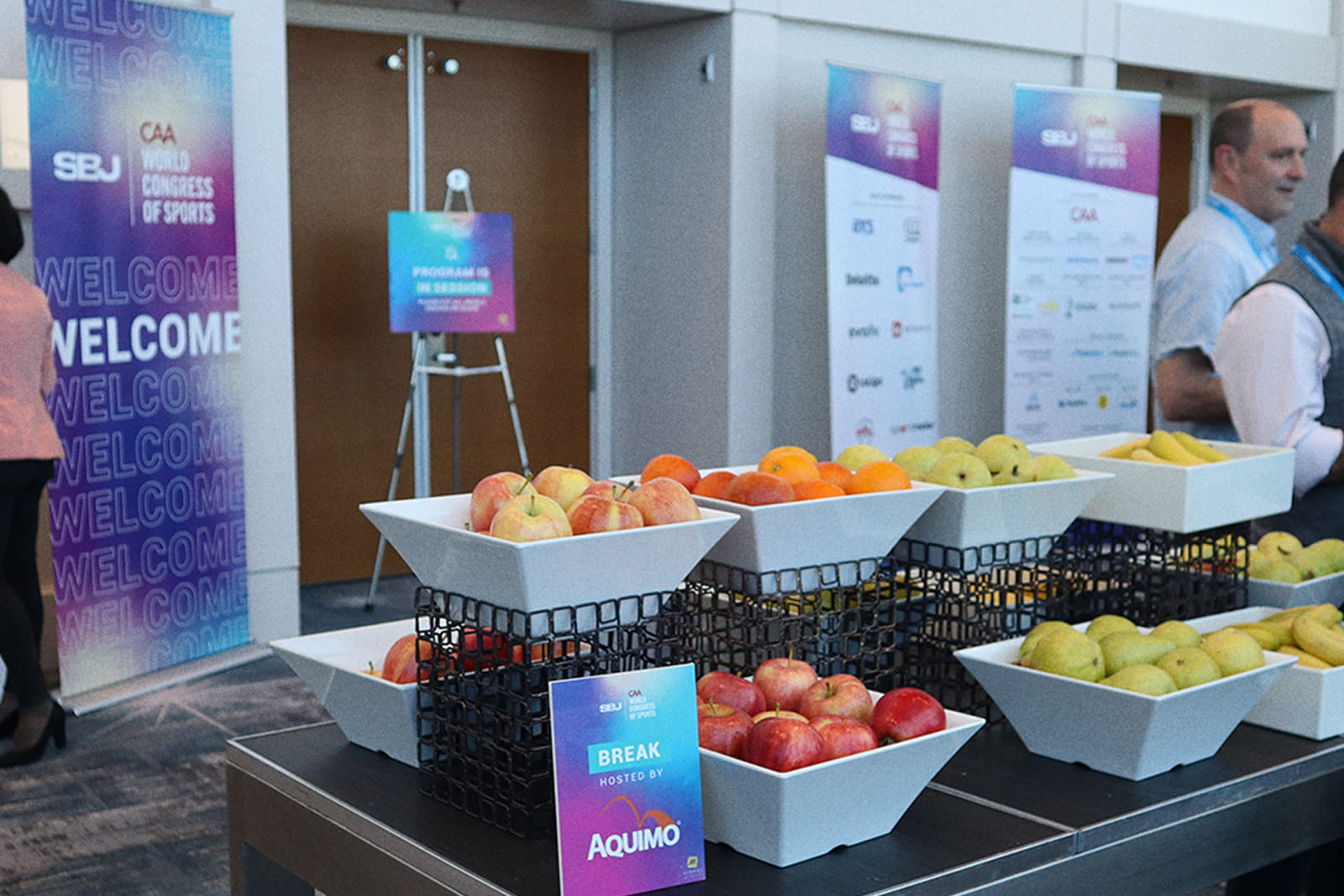 Conference registration and hospitality area featuring custom event signage and environmental graphics by A3 Visual.