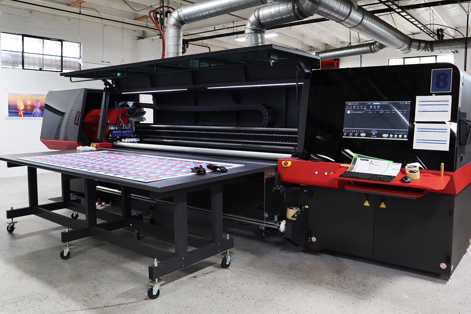 In-house large-format printing process at A3 Visual producing custom graphics for the Sports Business Journal World Congress of Sports.
